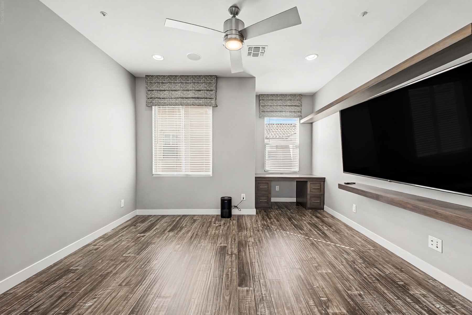 Finished office with integrated workspace and media wall